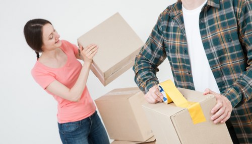Moving team handling furniture in a Perivale home
