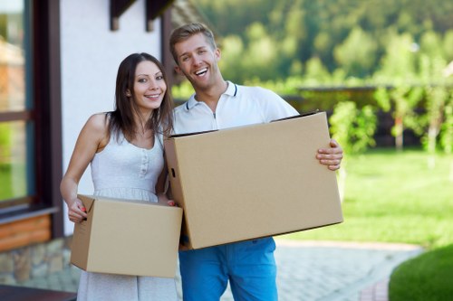 Boxes and furniture prepared for a home removal service in Perivale