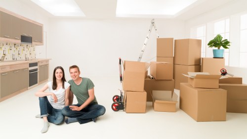 Packed boxes and furniture loaded into a moving truck in Perivale
