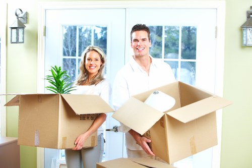 Packed moving boxes and furniture prepared for removals
