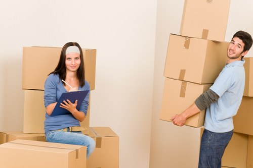 Prepared office workspace with labelled boxes and moving supplies