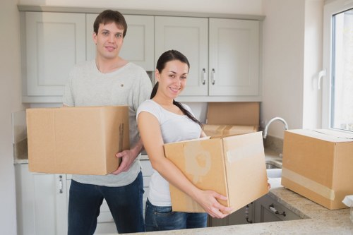 Furniture and boxes being loaded into a moving van in Perivale